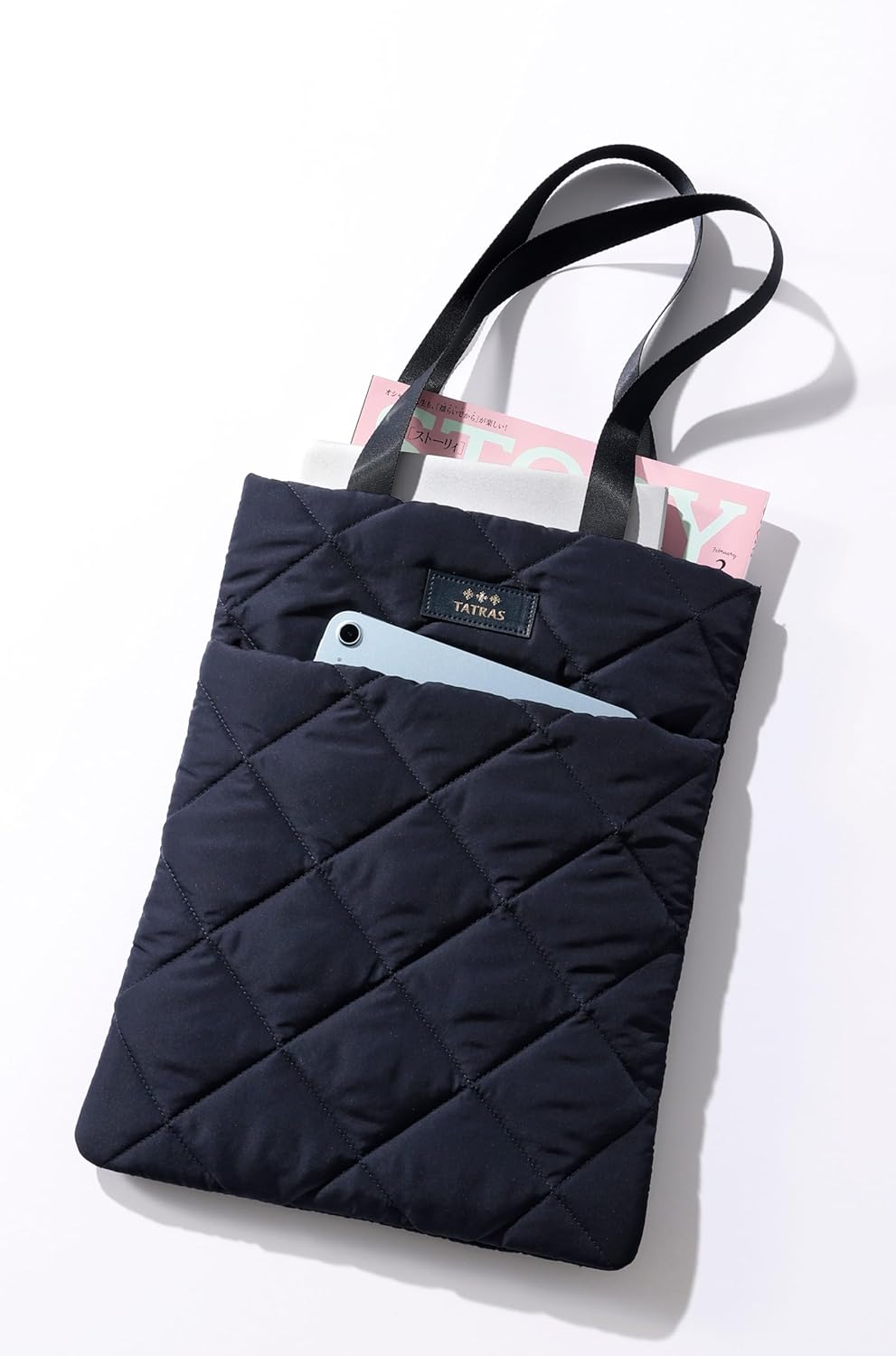 STORY April 2026 supplement cover features Nozomi Sasaki, and includes a free TATRAS soft navy blue tote bag. 